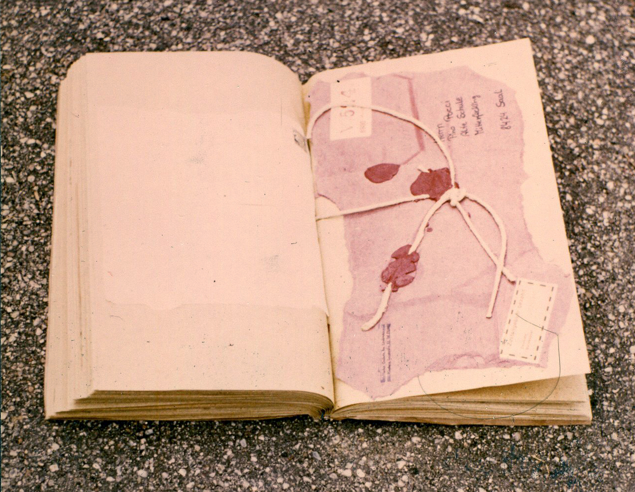 Modified found book - opened – with mixed media collage on page