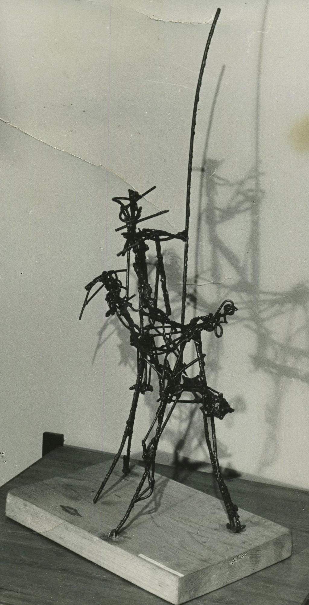WIre sculpture resembles figure with lance riding a horseback